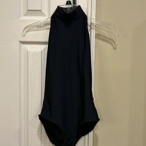 Yumiko women’s medium high neck black leotard. Pretty open back, bust lining.